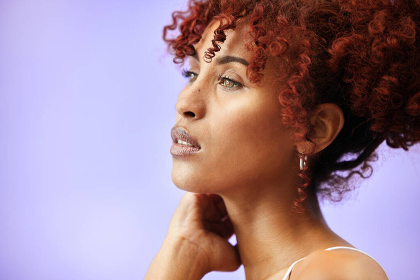 Face, profile and woman, natural beauty and hair with cosmetics and makeup isolated on purple background. Mockup space, wellness and thinking with red curls, skincare and model has glow in a studio. - Photo, Image