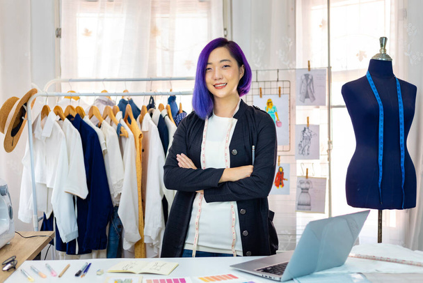 Portrait of Asian fashionable freelance dressmaker in her artistic workshop studio for fashion design and clothing business industry concept - Foto, Imagem