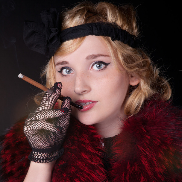Portrait of a woman in a retro style. Professional makeup in the style of 30s of the 20th century - Zdjęcie, obraz