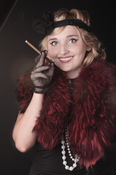 Portrait of a woman in a retro style. Professional makeup in the style of 30s of the 20th century - Фото, изображение