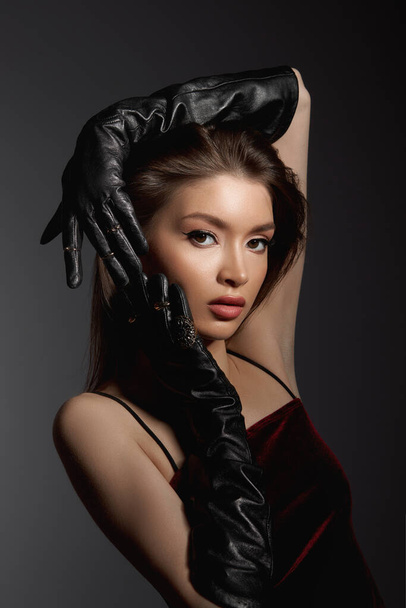 Fashion Woman in black gloves, portrait. Long hair, beauty beautiful eyes - Φωτογραφία, εικόνα