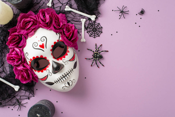 Mexican Day of Dead inspiration: top view of bride skeleton carnival mask with floral accents, black veil, confetti, bones. Eerie elements on lilac add intrigue, alongside empty space for text or ad - Photo, Image