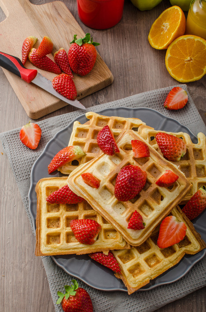 Homemade waffles with maple syrup and strawberries - Fotografie, Obrázek