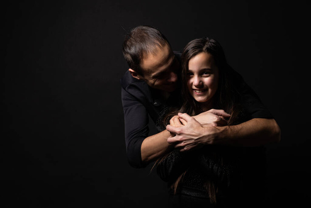 Loving daddy look at little adorable daughter feeling love isolated on studio background profile faces side view, deep devotion warm relationships, love care, closest person, fathers day concept. - Photo, Image