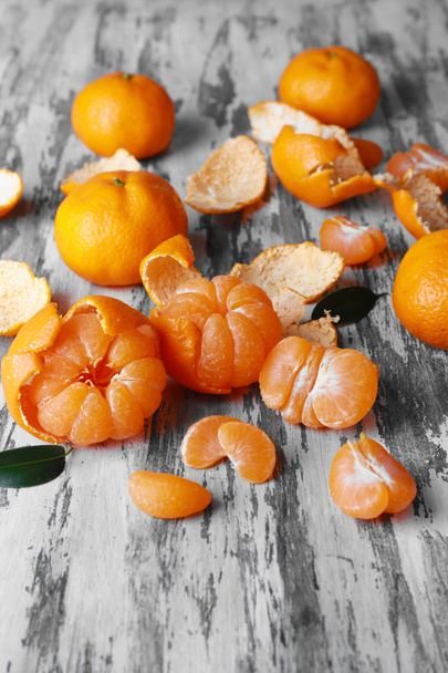 Tangerines on wooden table - Фото, изображение