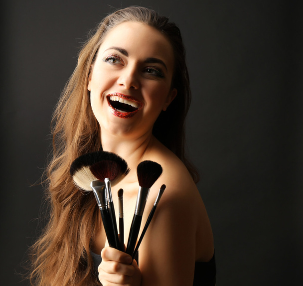 Portrait of beautiful woman with fancy glitter makeup on dark background - Zdjęcie, obraz