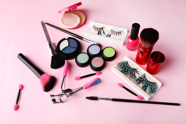 Set of decorative cosmetics on light colorful background - Photo, Image