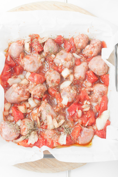 uncooked chopped sausages in baking dish - Photo, Image