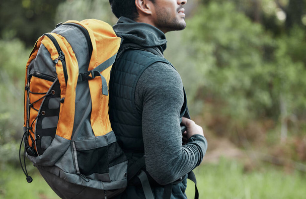 Man, backpack and closeup with view, thinking and camping travel in the forest for holiday. Exercise, trekking workout and hiking in the woods for vacation with freedom in nature on a journey. - Foto, imagen