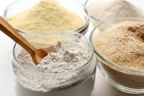 Different types of flour in bowls close up - Foto, immagini