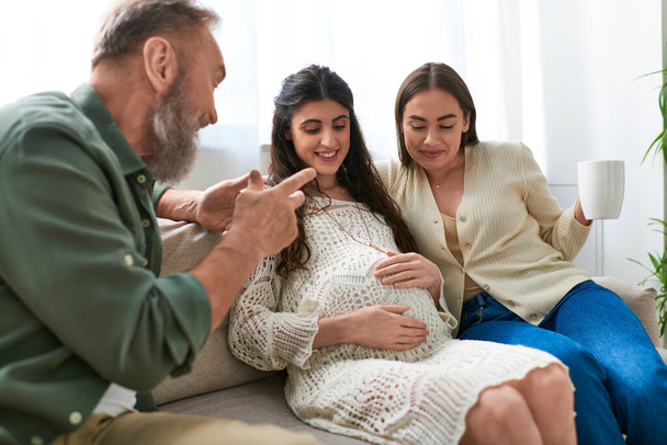 cheerful father paid visit to his lesbian daughter and her partner, drinking tea, ivf concept - Photo, Image