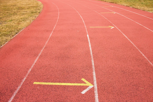 White lines and texture of running racetrack, red rubber racetracks in small stadium - Photo, Image