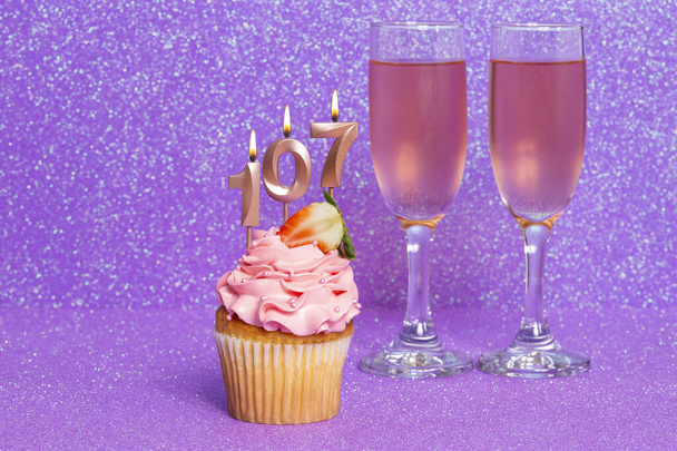 Cupcake With Number And Glasses With Wine For Birthday Or Anniversary Celebration; Number One Hundred Seven. - Photo, Image