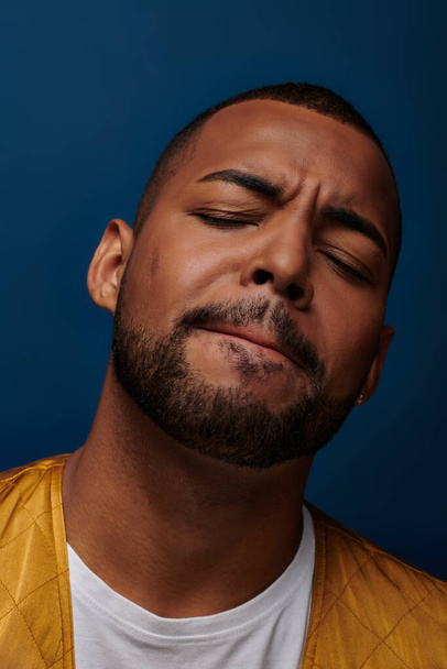 portrait of contented handsome african american man with beard closing his eyes, fashion concept - Photo, Image