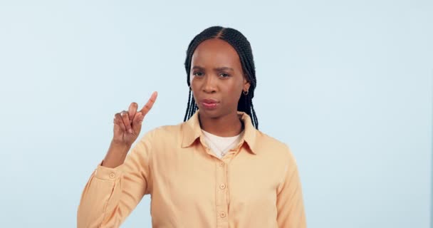 No, finger and face of woman in studio with head shake for stop, wrong and warning on white background. Portrait, hand and angry african model refuse sign of rejection, emoji and caution of danger. - Imágenes, Vídeo