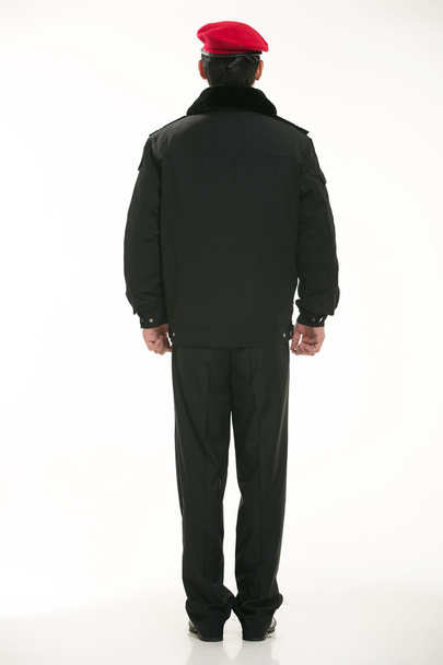 Vytvořit všechny druhy pracovních oděvů policista stojí před bílým pozadím - Fotografie, Obrázek