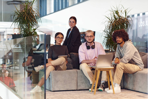 In a modern startup office, a diverse group of young professionals collaboratively tackles various business problems and challenges, surrounded by their engaged colleagues, fostering innovation and - Foto, immagini