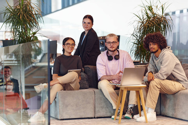 In a modern startup office, a diverse group of young professionals collaboratively tackles various business problems and challenges, surrounded by their engaged colleagues, fostering innovation and - Fotografie, Obrázek