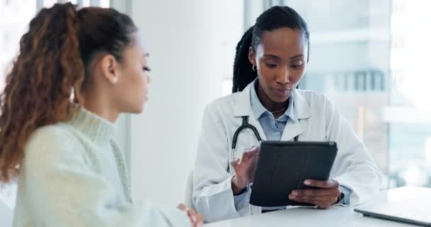 Doctor, tablet and black woman consultation with patient about medical diagnosis, hospital test or health. Clinic, client relief and professional surgeon consulting with person on good exam results. - Footage, Video