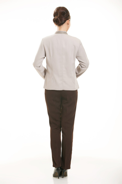 Oblečená v montérkách, kteří stojí před bílým pozadím - Fotografie, Obrázek
