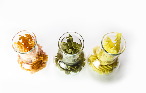 Colored pasta in a glass - Фото, зображення
