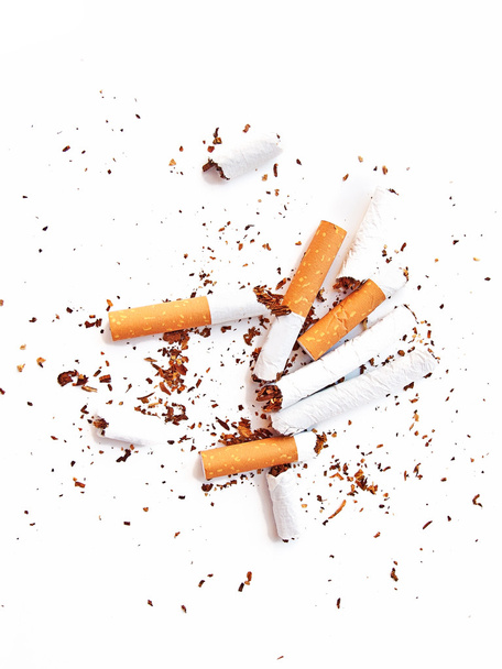 Various broken cigarettes and butts as a give up smoking concept - Foto, Imagen