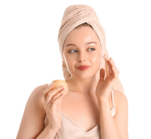 Pretty young woman after shower and with cream on white background - Photo, Image