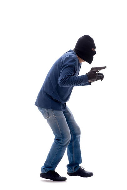 Jeune cambrioleur tenant une arme de poing isolée sur blanc - Photo, image