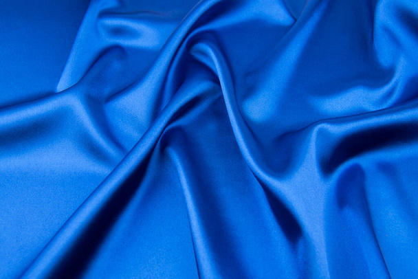 Tejido azul satinado o de seda como fondo - Foto, imagen
