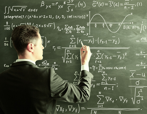 Businessman writing formula - Photo, Image
