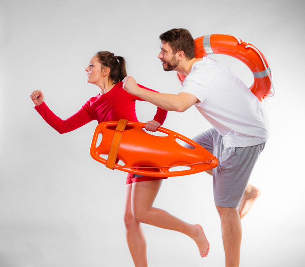 Lifeguards running with equipment - Foto, imagen