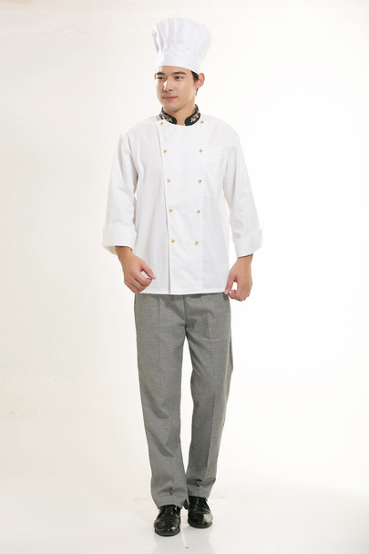 Usando todo tipo de ropa de chef dietista en frente de fondo blanco - Foto, imagen