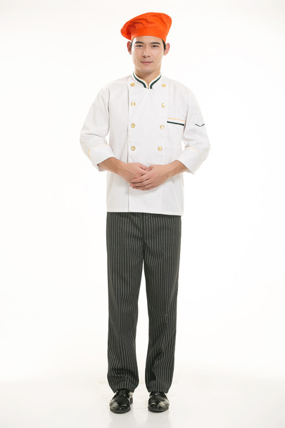 Het dragen van allerlei kleding chef-kok diëtist in de voorkant van witte achtergrond - Foto, afbeelding