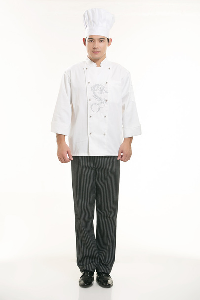 Het dragen van allerlei kleding chef-kok diëtist in de voorkant van witte achtergrond - Foto, afbeelding
