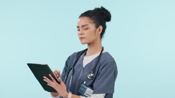 Woman, doctor and tablet in medical research, healthcare results or Telehealth against a studio background. Female person or nurse working on technology in online search or networking on mockup space. - Footage, Video