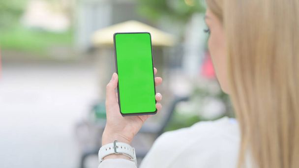 Woman Using Smartphone with Green Screen Outdoor - Photo, Image