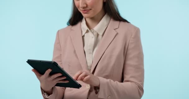 Hands, tablet and research with a business woman on a blue background in studio for planning. Technology, social media or web app with an employee closeup for innovation or a search on the internet. - Footage, Video