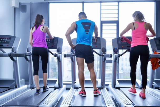 Group of people running on treadmills - Fotó, kép