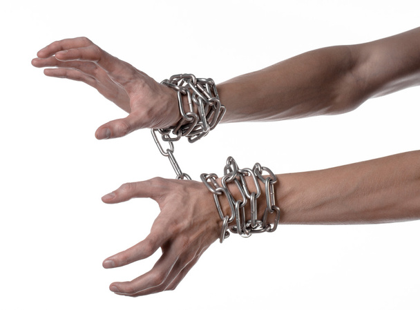 Social theme: hands tied a metal chain on a white background - Zdjęcie, obraz