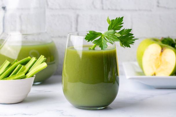 A glass of green celery juice. Celery drink prepared for healthy nutrition and detox. - Fotografie, Obrázek