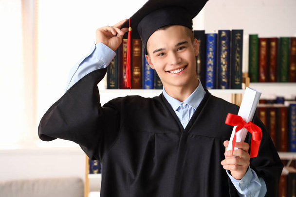 Male graduate student with diploma at university - Φωτογραφία, εικόνα