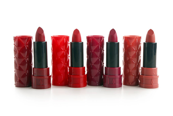 Different new red lipsticks on white background - Photo, Image
