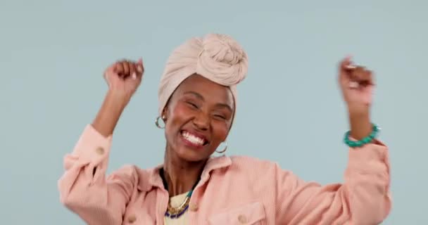 Black woman, happy and dancing to success in studio to celebrate party, promotion or lottery bonus on grey background. Excited model, giveaway winner and energy for prize deal, disco music or freedom. - Footage, Video