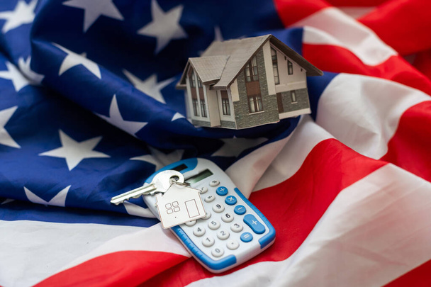 Buying real estate in the USA. American house keys. Moving to new york. Flag and keys close-up. Renting an apartment abroad. High quality photo - Photo, Image