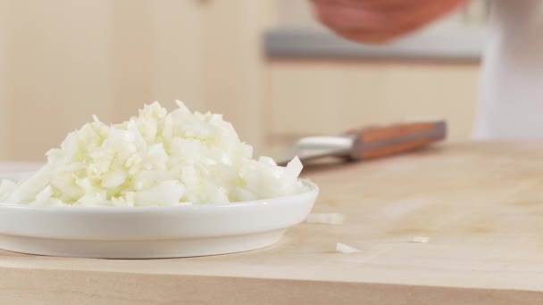 Garlic being added to onion - Footage, Video