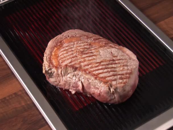 Grilling beefsteak on grill - Footage, Video
