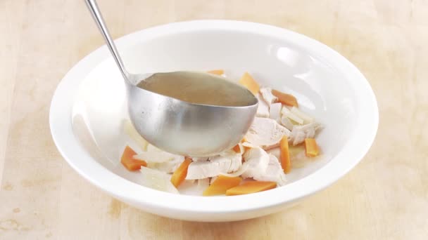 Broth being poured over chicken breast - Footage, Video