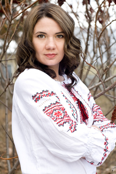 Portrait of a beautiful young Ukrainian embroidered shirt - Photo, Image