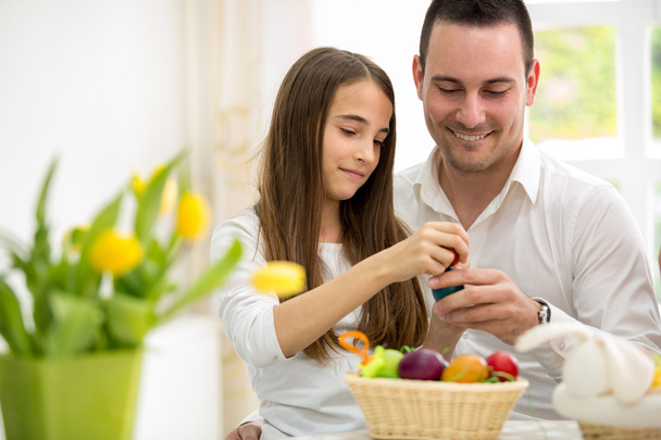 Daughter and father having fun with Easter eggs - Fotoğraf, Görsel