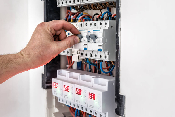 Repairing or switch off the switchboard voltage with automatic switches. Electrical background - Photo, Image